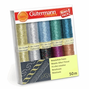 May include: A Gütermann Creativ bonus pack containing five spools of metallic effect thread in gold, silver, light blue, green, and copper. Each spool contains 50 meters of thread. The packaging displays embroidery examples and the text Metallic Effect Thread.