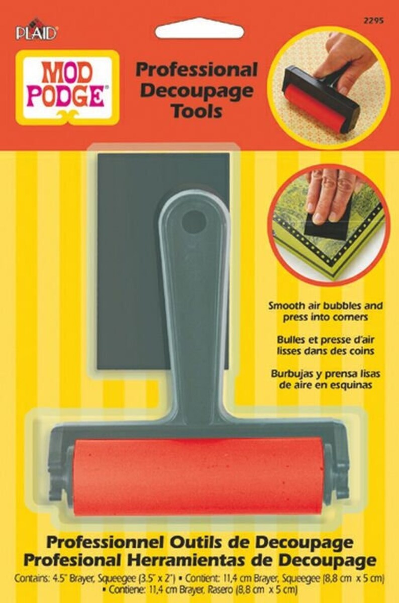 May include: A set of professional decoupage tools, including a 4.5 inch brayer and a 3.5 by 2 inch squeegee. The tools are red and gray and are shown on a yellow and white striped background. The packaging includes the text "Professional Decoupage Tools" and "Mod Podge".