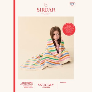 May include: A child wrapped in a colorful, striped knitted blanket. The blanket features horizontal stripes in various colors, including pink, blue, yellow, and green. The image also includes text that reads "Sirdar" and "Snuggly Chunky."