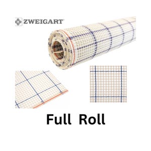 May include: A full roll of Zweigart Aida cloth, a white fabric with blue and red grid lines. The cloth is rolled up and the label is visible. The text on the label reads "ZWEIGART".
