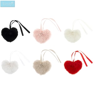 May include: Six heart-shaped fluffy ornaments in black, pink, white, beige, and red. Each has a ribbon for hanging. The ornaments are made of a soft, plush material. Ideal for decorations.