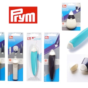 May include: A set of Prym chalk cartridges for sewing. The cartridges are in different colours, including yellow, white, blue, and purple. The cartridges are packaged in clear plastic boxes with the Prym logo.