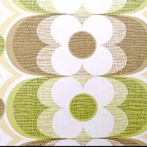 May include: A vintage wallpaper pattern with a repeating design of brown, green, and white circles and flowers. The pattern has a textured look.