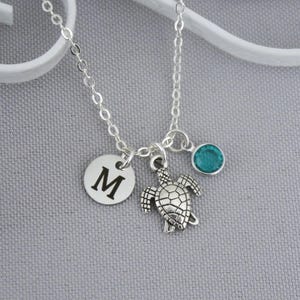 May include: A handmade wooden sign with the text "Welcome" in a playful font. The sign features a distressed white background and a dark brown border. A small, decorative heart is attached to the bottom. The sign measures approximately 12 inches wide.