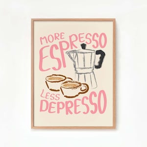 May include: A framed print with a pink and black illustration of a coffee pot and two cups of coffee. The text reads "More Espresso Less Depresso".