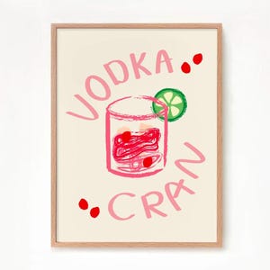 May include: A pink and white illustrated print with the text "VODKA... CRAN" and a pink illustration of a glass of cranberry juice with a lime wedge.
