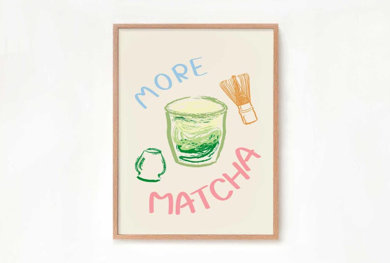 May include: A framed print with a light beige background featuring a green matcha drink in a glass, a green matcha whisk, and the text "MORE MATCHA" in pink, blue, and orange.