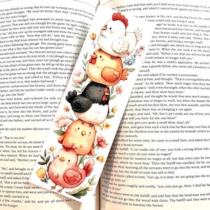 May include: A colorful bookmark featuring a stack of watercolor chicks with floral accents. The bookmark is placed in an open book with text from the Brothers Grimm Fairy Tales.