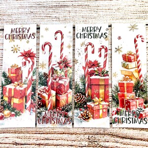 May include: Four Christmas-themed bookmarks with watercolor illustrations. Each bookmark features a stack of wrapped gifts, candy canes, and the text "MERRY CHRISTMAS". The gifts are red and gold, with green accents.