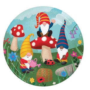 May include: Three gnomes in a whimsical garden setting. One gnome sits on a red and white mushroom, another gnome holds a watering can, and the third gnome holds a red and blue striped stick. The gnomes are surrounded by green grass, flowers, and a ladybug.