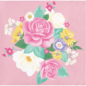 May include: A pink floral design with a bouquet of pink, white, and yellow flowers on a pink background. The flowers are surrounded by green leaves.