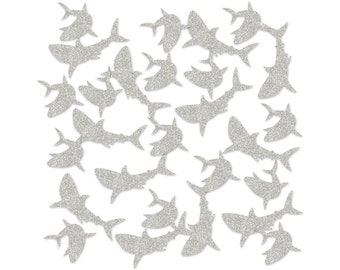 May include: A set of silver glitter shark confetti. The sharks are cut out in a variety of sizes and poses.