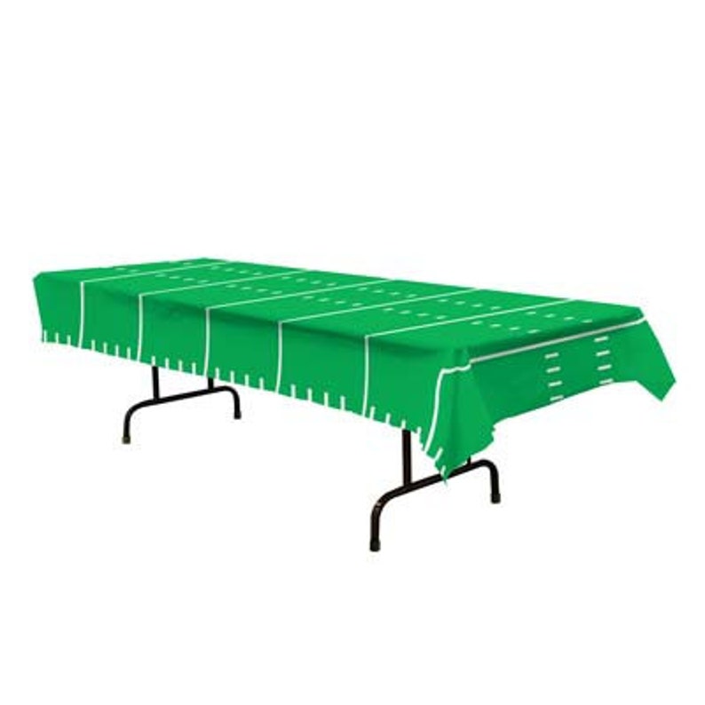 May include: Green plastic tablecloth with a football field design. The tablecloth is laid out on a black metal table.