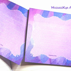 May include: Two purple and blue watercolor note cards with a white border and a white stitched frame. The text "WhimsIkya Arts" is printed on both cards.
