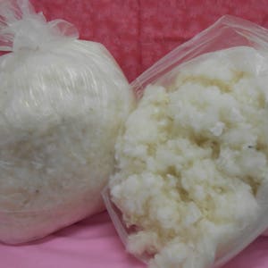 Natural wool washed and picked for stuffing pillows, dolls, pincushion or needle felting projects for the inside  with colored wool outside.