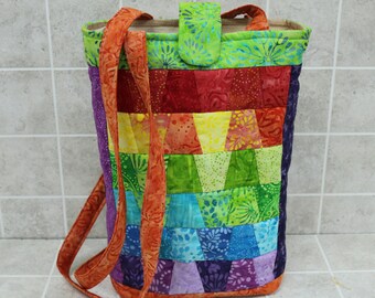 Bright Batik hand bag, a rainbow of colors in a mini tumbler style, long handles, hand quilted, liner with zipper or open pocket