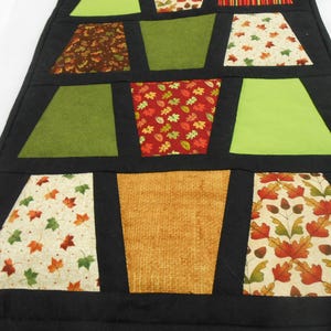 Tumbler table runner, the fall tumblers tremed in black makes a nice fall table topper, hand quilted. image 3