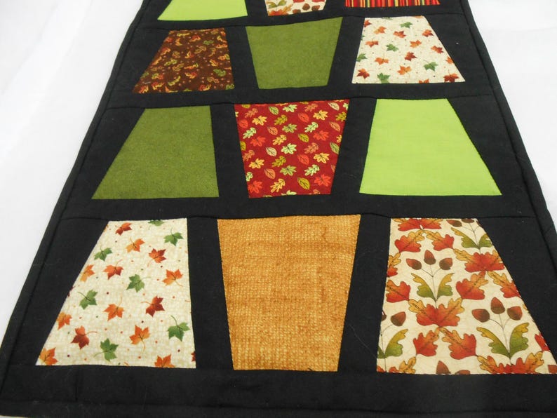 Tumbler table runner, the fall tumblers tremed in black makes a nice fall table topper, hand quilted. image 3
