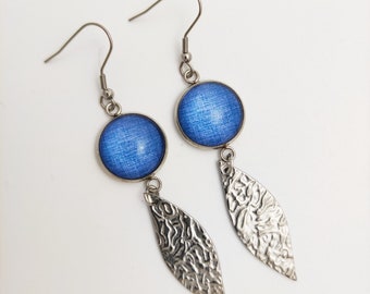 Dangling earrings. Blue denim fabric effect glass cabochon. Long hammered charm. Gift idea