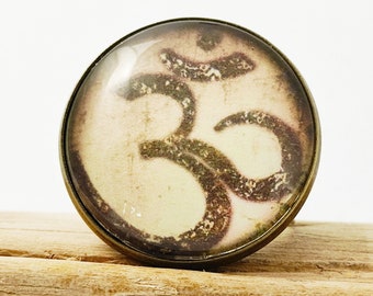 Large adjustable bronze-colored metal ring. Round glass cabochon. Om. Zen. Buddha. Boho. Hippie.