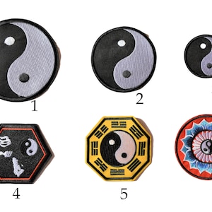 May include: A selection of six embroidered Yin and Yang patches. The patches are in various shapes, including round and hexagonal, and feature black, white, and other colours. Suitable for clothing or accessories, these patches are ideal for customisation.
