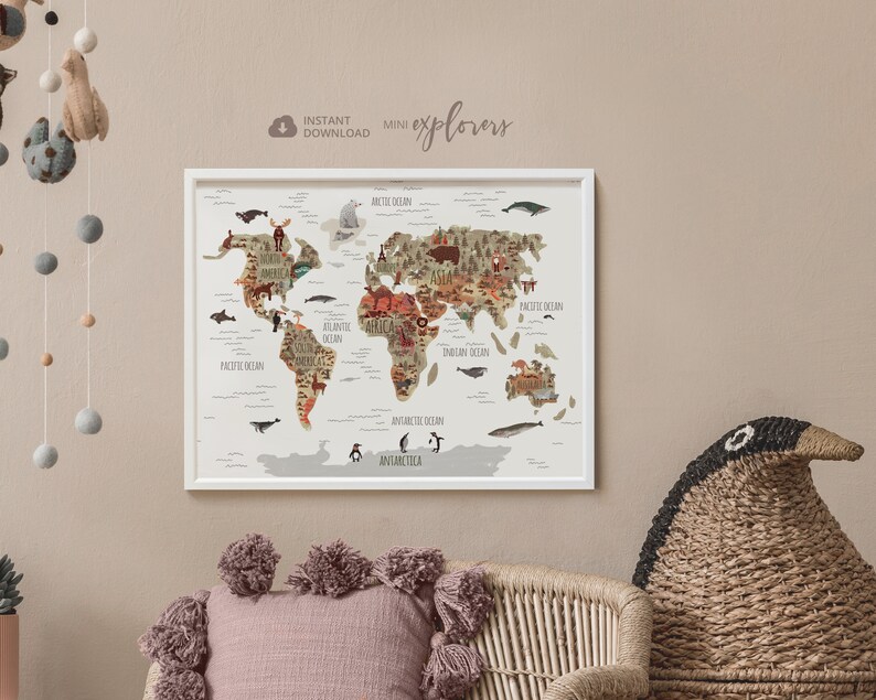May include: A white framed world map print with a brown and beige color scheme. The map features illustrations of animals and continents. The text "Instant Download Mini Explorers" is at the top of the print.
