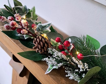 Snowy Foliage Garland with Red Berries, Pine Cones, and Micro Lights – Christmas Mantel Arrangement