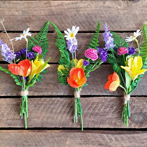 Bud vase bunch of artificial bright flowers