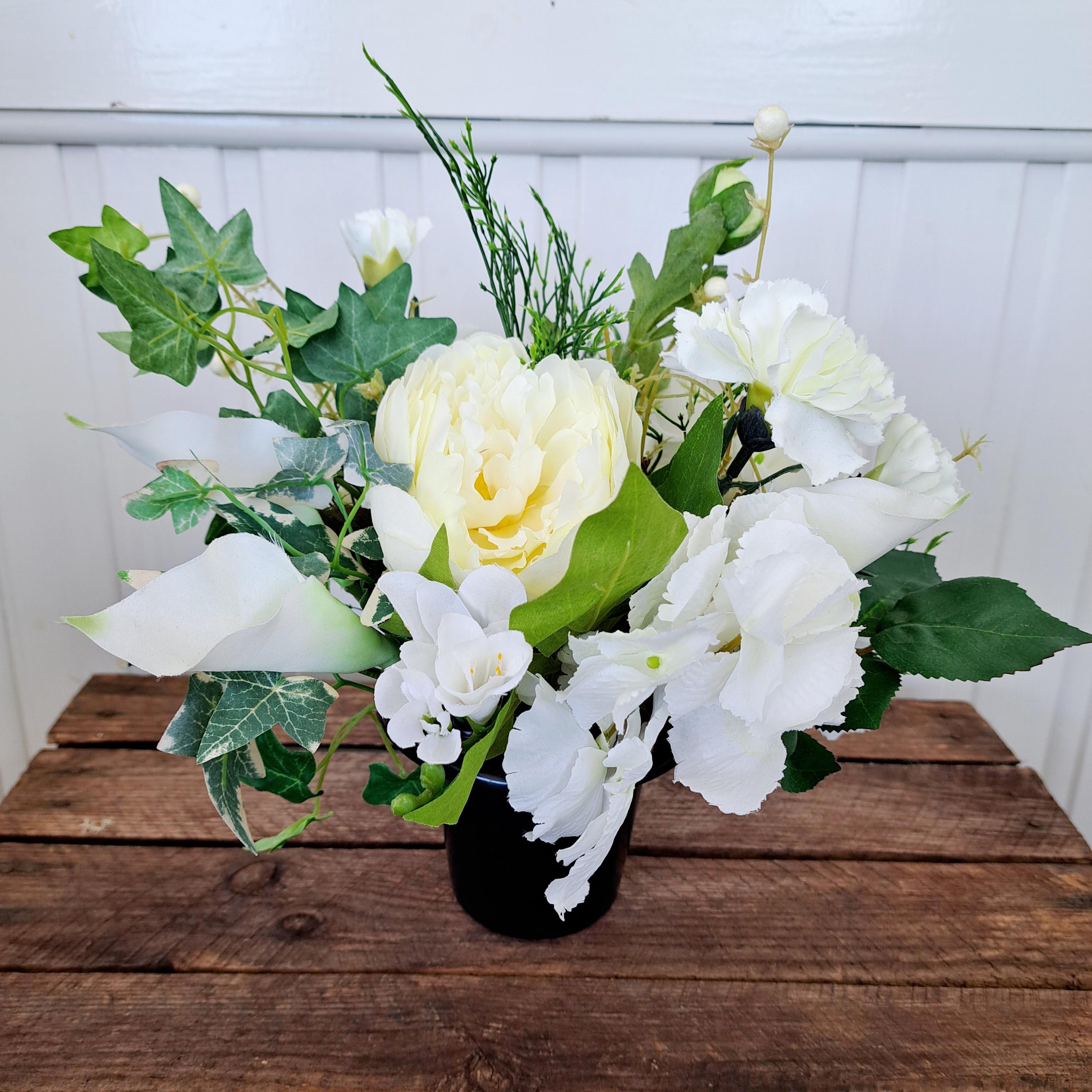 Artificial cemetery flowers in cream and whites
