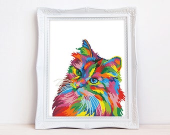 May include: A colorful, abstract cross-stitch pattern of a cat's face. The cat's fur is a mix of bright colors, including pink, blue, green, yellow, and orange.