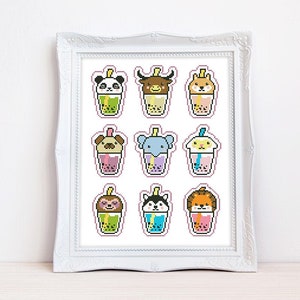 May include: A white framed print with nine colorful pixel art images of animals drinking bubble tea. The animals include a panda, bull, fox, pug, elephant, bunny, sloth, husky, and lion.