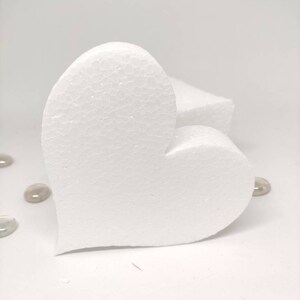 May include: A white foam heart shape, perfect for crafting projects. The heart is made of a lightweight, durable material and is easy to cut and shape.