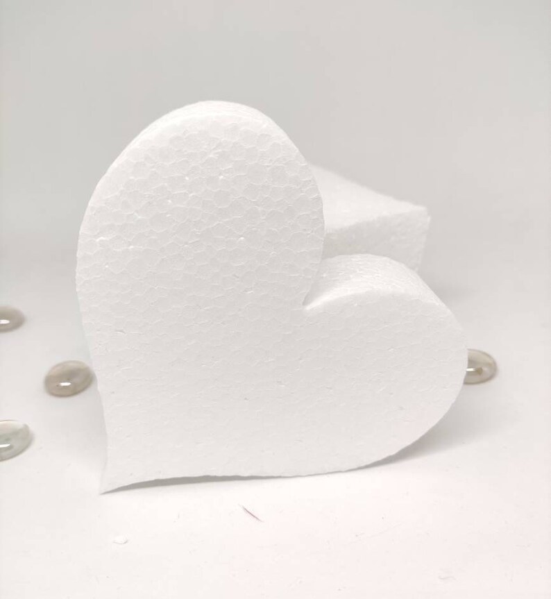 May include: A white foam heart shape, perfect for crafting projects. The heart is made of a lightweight, durable material and is easy to cut and shape.