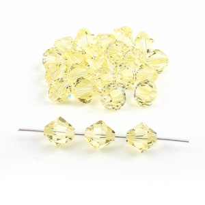 24 pcs bicone beads, Jonquil color Swarovski crystal article 5328, xilion cut, Irina Miech, 8mm