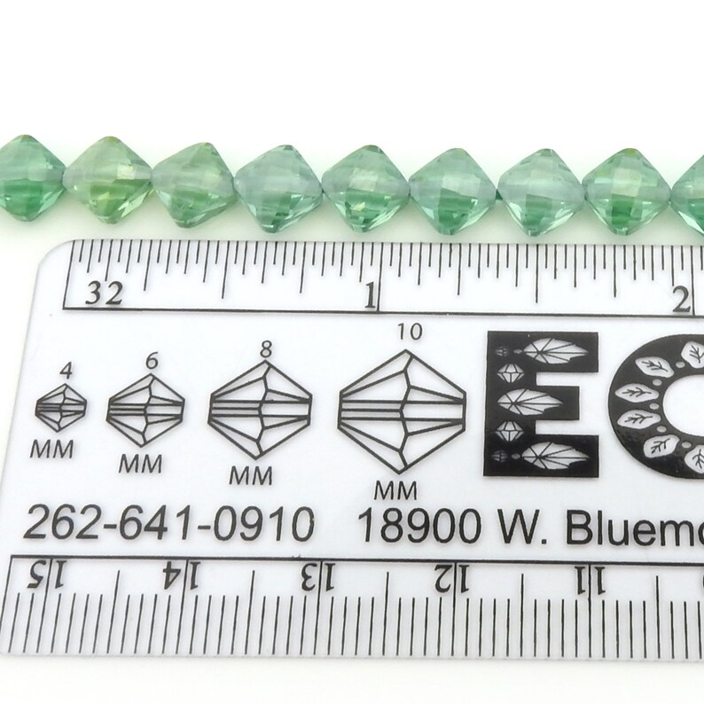 Irina Miech Small faceted light emerald CZ beads 5 strand 7mm x 6mm green cubic zirconia flattened diamond shape