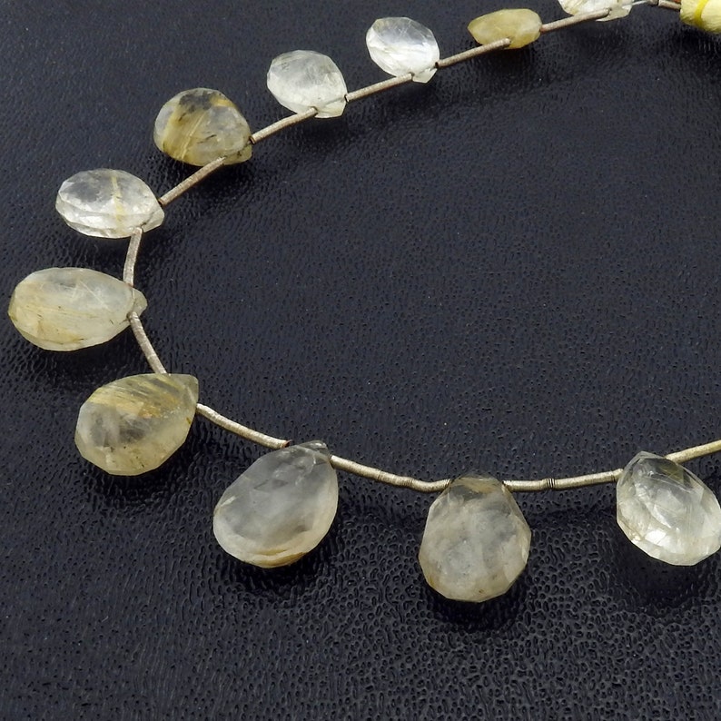 NATURAL RUTILATED QUARTZ ROUND 14mm FACETED BEADS 15" STRAND NATURAL RUTILATED QUARTZ ROUND 14mm FACETED BEADS 15" STRAND