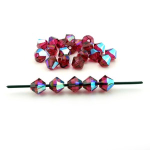 24 pcs ruby AB Swarovski crystal bicone beads, ruby AB color, article 5328 xilion cut, Irina Miech, 5mm
