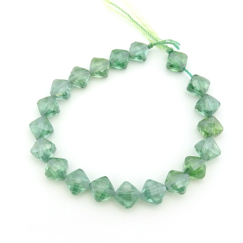 Irina Miech Small faceted light emerald CZ beads 5 strand 7mm x 6mm green cubic zirconia flattened diamond shape