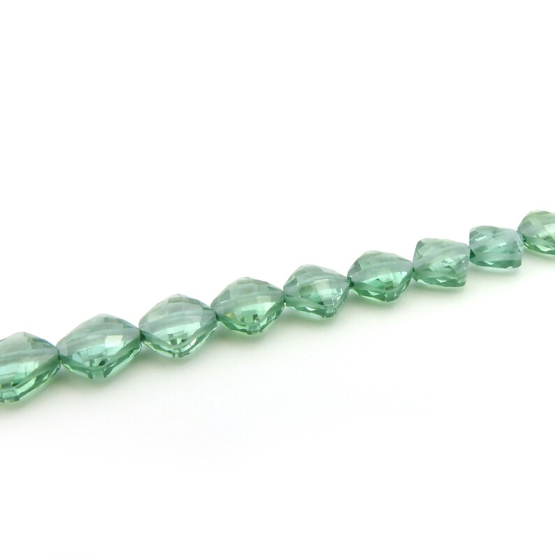 Irina Miech Small faceted light emerald CZ beads 5 strand 7mm x 6mm green cubic zirconia flattened diamond shape