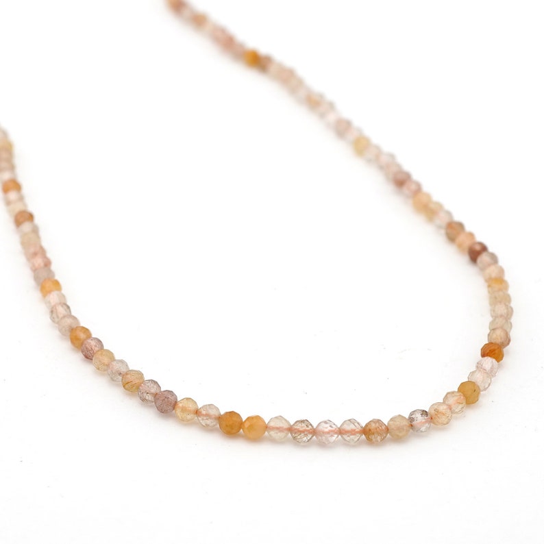 NATURAL RUTILATED QUARTZ ROUND 14mm FACETED BEADS 15" STRAND NATURAL RUTILATED QUARTZ ROUND 14mm FACETED BEADS 15" STRAND