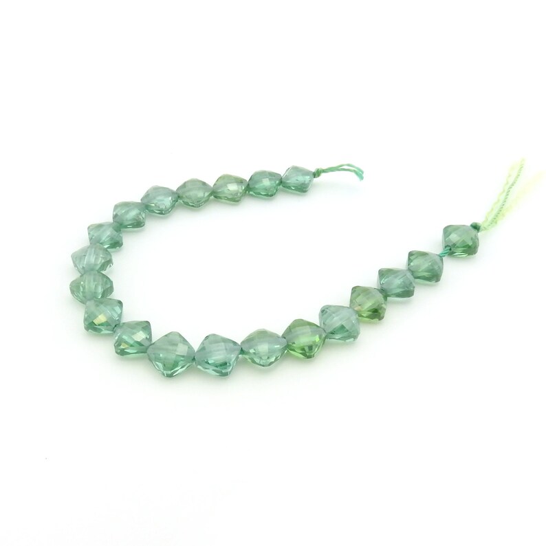 Irina Miech Small faceted light emerald CZ beads 5 strand 7mm x 6mm green cubic zirconia flattened diamond shape