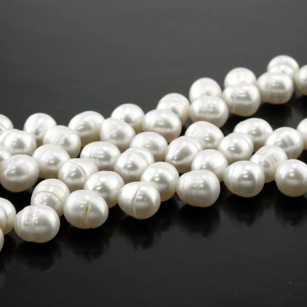 White diagonally drilled freshwater pearls, cultured, 1 strand, 7mm x 5mm, Snow Blossom color