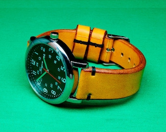 May include: A silver wristwatch with a black face and white numbers. The watch has a yellow leather band with black stitching.