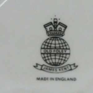 May include: Black and white logo on a white background. The logo features a globe with the text "Old Foley" inside. Below the globe is a banner with the text "James Kent" and below the banner is the text "Made in England".