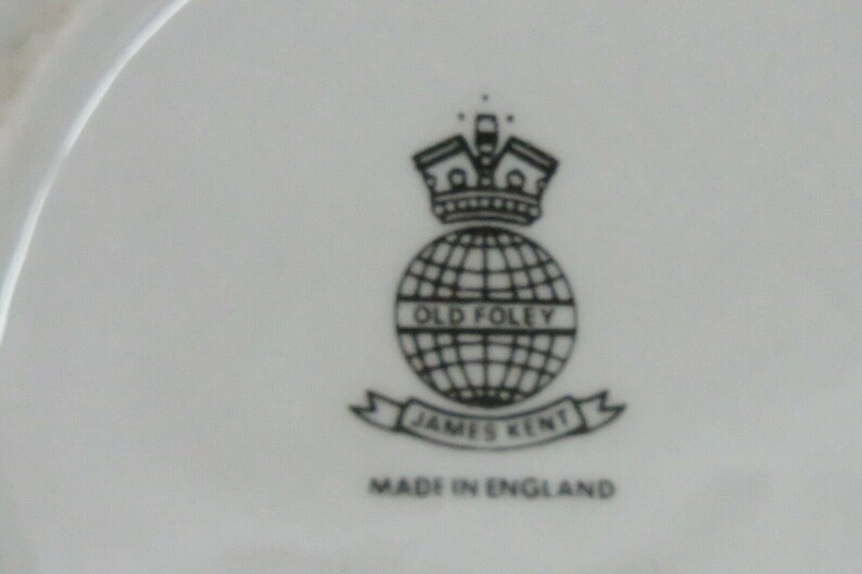May include: Black and white logo on a white background. The logo features a globe with the text "Old Foley" inside. Below the globe is a banner with the text "James Kent" and below the banner is the text "Made in England".
