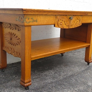 Early 1900s Carved Tiger Oak Console library Table 5316 SHIPPING NOT INCLUDED Please ask for shipping quote