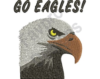 May include: A close-up of an embroidered image of a bald eagle's head with a yellow eye. The eagle is looking to the right. The text "GO EAGLES!" is above the eagle.