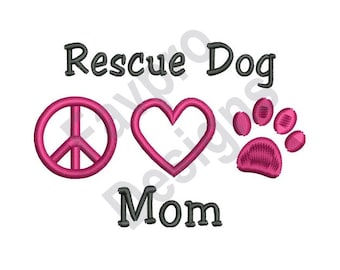 May include: Embroidered design featuring the words "Rescue Dog Mom" with a pink peace sign, heart, and paw print.