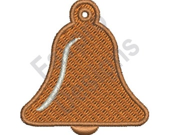 Puede incluir: Diseño de campana bordada en tonos marrón y beige, con un acento blanco curvo. La campana tiene un lazo en la parte superior para colgar y una base redondeada. El diseño tiene una apariencia texturizada.