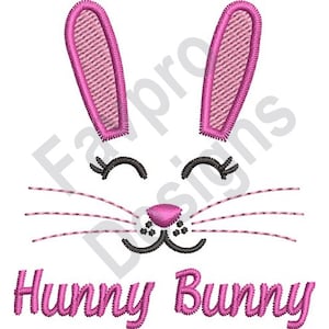 May include: Pink embroidered bunny face with the text "Hunny Bunny" underneath.